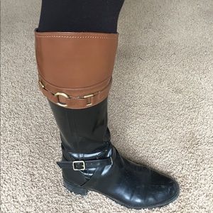 Black and brown riding boots